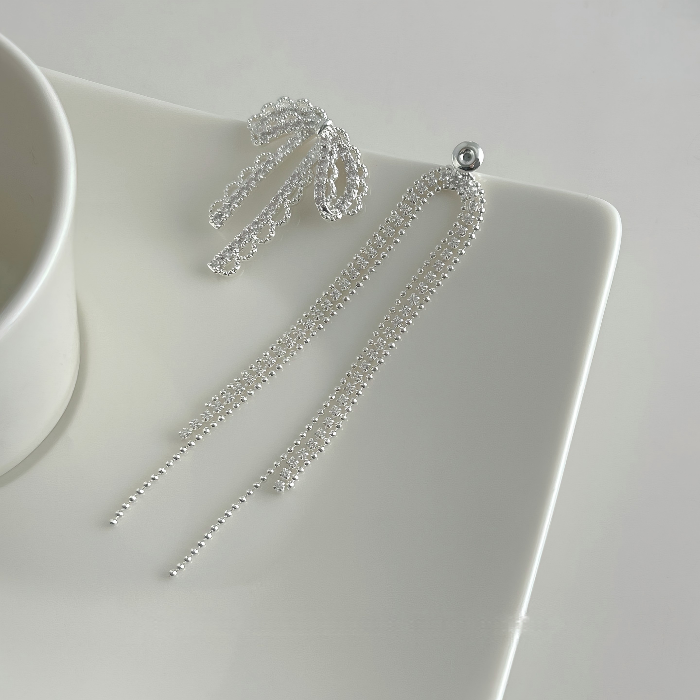 Celeste Crystal Bow Tassel Earrings
