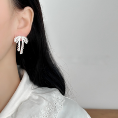 Celeste Crystal Bow Tassel Earrings